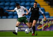 25 March 2019; Simon Falvey of Colleges & Universities in action against Scott Delaney of Defence Forces during the match between Colleges & Universities and Defence Forces at  Athlone Town Stadium in Athlone, Co. Westmeath. Photo by Harry Murphy/Sportsfile