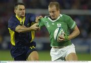 11 October 2003; Denis Hickie, Ireland, in action against Cristian Sauan, Romania. 2003 Rugby World Cup, Pool A, Ireland v Romania, Central Coast Stadium, Gosford, New South Wales, Australia. Picture credit; Brendan Moran / SPORTSFILE *EDI*