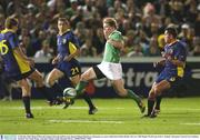 11 October 2003; Brian O'Driscoll, Ireland, kicks the ball forward ahead of Danut Dumbrava, Romania, in a move which led to Denis Hickie's first try. 2003 Rugby World Cup, Pool A, Ireland v Romania, Central Coast Stadium, Gosford, New South Wales, Australia. Picture credit; Brendan Moran / SPORTSFILE *EDI*