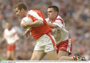 28 September 2003; Tony McEntee, Armagh, in action against Tyrone's Ryan McMenamin. Bank of Ireland All-Ireland Senior Football Championship Final, Armagh v Tyrone, Croke Park, Dublin. Picture credit; Matt Browne / SPORTSFILE *EDI*