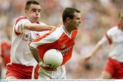 28 September 2003; Steven McDonnell, Armagh, in action against Tyrone's Ryan McMenamin. Bank of Ireland All-Ireland Senior Football Championship Final, Armagh v Tyrone, Croke Park, Dublin. Picture credit; Matt Browne / SPORTSFILE *EDI*