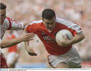 28 September 2003; Oisin McConville, Armagh, in action against Tyrone's Conor Gormley. Bank of Ireland All-Ireland Senior Football Championship Final, Armagh v Tyrone, Croke Park, Dublin. Picture credit; Matt Browne / SPORTSFILE *EDI*