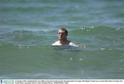 16 October 2003; Ireland flanker Eric Miller cools down in the sea near the team hotel in Terrigal. 2003 Rugby World Cup, Crowne Plaza Hotel, Terrigal, New South Wales, Australia. Picture credit; Brendan Moran / SPORTSFILE *EDI*