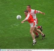 28 September 2003; Kieran McGeeney, Armagh, in action against Brian McGuigan, Tyrone. Bank of Ireland All-Ireland Senior Football Championship Final, Armagh v Tyrone, Croke Park, Dublin. Picture credit; Ray McManus / SPORTSFILE