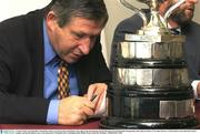 17 October 2003; Liam Mulvihill, Ard Stiurthoir of the GAA, looks closely at the Railway Cup trophy at the announcement that the 2003 Inter-Provincial Hurling Championship will be played in Rome on November 8th next, it will be played in the Giulio Onesti Sports Complex, and that the Railway Cup is to be sponsored by M Donnelly and Co. Burlington Hotel, Dublin. Picture credit; Ray McManus / SPORTSFILE *EDI*