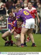 19 October 2003; Jason Ward, St. Brigids, in action against Jonathan Magee, (6), Kilmacud Crokes. Dublin County Football Final, Kilmacud Crokes v St. Brigids, Parnell Park, Dublin. Picture credit; Damien Eagers / SPORTSFILE *EDI*