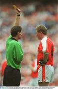 28 September 2003; Referee Brian White, issues a yellow card to Francie Bellew of Armagh. Bank of Ireland All-Ireland Senior Football Championship Final, Armagh v Tyrone, Croke Park, Dublin. Picture credit; Brendan Moran / SPORTSFILE