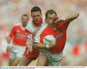 28 September 2003; Paddy McKeever, Armagh in action against Tyrone's Conor Gormley. Bank of Ireland All-Ireland Senior Football Championship Final, Armagh v Tyrone, Croke Park, Dublin. Picture credit; Brendan Moran / SPORTSFILE