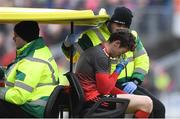 24 March 2019; Mayo goalkeeper David Clarke leaves the field on a medical buggy, after a first half challenge from Darren Hughes of Monaghan, who was shown a yellow card by referee Derek O'Mahoney, during the Allianz Football League Division 1 Round 7 match between Mayo and Monaghan at Elverys MacHale Park in Castlebar, Mayo. Photo by Piaras Ó Mídheach/Sportsfile