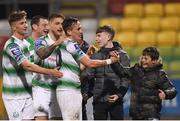 29 March 2019; Aaron McEneff of Shamrock Rovers celebrates with team-mates and supporters after scoring his side's third goal during the SSE Airtricity League Premier Division match between Shamrock Rovers and UCD at Tallaght Stadium in Dublin. Photo by Eóin Noonan/Sportsfile