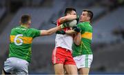 30 March 2019; Shane McGuigan of Derry in action against Paddy Maguire, right, and Shane Quinn of Leitrim during the Allianz Football League Division 4 Final between Derry and Leitrim at Croke Park in Dublin. Photo by Ray McManus/Sportsfile