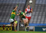 30 March 2019; Emmett Bradley of Derry in action against Dean McGovern and Shane Quinn, left, of Leitrim during the Allianz Football League Division 4 Final between Derry and Leitrim at Croke Park in Dublin. Photo by Ray McManus/Sportsfile