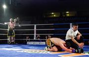 30 March 2019; Aiden Metcalfe is counted out by the referee as Allen Phelan watches on during their vacant BUI Celtic Super Featherweight title bout at the National Stadium in Dublin. Photo by Seb Daly/Sportsfile