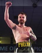 30 March 2019; Allen Phelan celebrates following his vacant BUI Celtic Super Featherweight title bout against Aiden Metcalfe at the National Stadium in Dublin. Photo by Seb Daly/Sportsfile