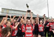 30 March 2019; Mullingar captain Caoimhe Ryan lifts the cup as her team-mates celebrate after the Leinster Rugby Girls U16 Girls Bowl Final match between Mullingar and Westmanstown at Navan RFC in Navan, Co Meath. Photo by Matt Browne/Sportsfile