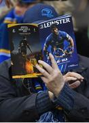 30 March 2019; A Leinster supporter reads the match program prior to the Heineken Champions Cup Quarter-Final between Leinster and Ulster at the Aviva Stadium in Dublin. Photo by Stephen McCarthy/Sportsfile