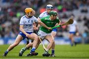 31 March 2019; Seán Finn of Limerick is tackled by Peter Hogan, left, and Stephen Bennett of Waterford during the Allianz Hurling League Division 1 Final match between Limerick and Waterford at Croke Park in Dublin. Photo by Stephen McCarthy/Sportsfile