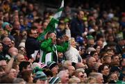 31 March 2019; Limerick supporters, in the Cusack Stand, celebrate a score during the Allianz Hurling League Division 1 Final match between Limerick and Waterford at Croke Park in Dublin. Photo by Ray McManus/Sportsfile
