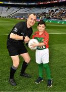 30 March 2019; Referee Brendan Cawley with Kaya Taz, Drumcong NS, and the Kiltubrid Club, Co. Leitrim, before the Allianz Football League Division 4 Final between Derry and Leitrim at Croke Park in Dublin. Photo by Ray McManus/Sportsfile