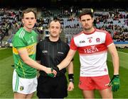 30 March 2019; Referee Brendan Cawley with the Leitrim captain, Micheal McWeeney, and the Derry captain, Christopher McKaigue, before the Allianz Football League Division 4 Final between Derry and Leitrim at Croke Park in Dublin. Photo by Ray McManus/Sportsfile