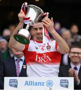 30 March 2019; Christopher McKaigue of Derry lifts the cup after the Allianz Football League Division 4 Final between Derry and Leitrim at Croke Park in Dublin. Photo by Ray McManus/Sportsfile