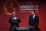 4 April 2019; Tournament ambassador John O'Shea, right, and UEFA Head of National Team Competitions Lance Kelly pulls the name of Czech Republic during the 2019 UEFA European Under-17 Championship Finals Draw at the Aviva Stadium in Dublin. Photo by Stephen McCarthy/Sportsfile