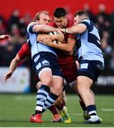 5 April 2019; Conor Murray of Munster in action against Kristian Dacey, left, and Dillon Lewis of Cardiff Blues during the Guinness PRO14 Round 19 match between Munster and Cardiff Blues at Irish Independent Park in Cork. Photo by Ramsey Cardy/Sportsfile