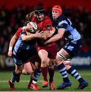 5 April 2019; Tyler Bleyendaal of Munster is tackled by Kristian Dacey, left, and Seb Davies of Cardiff Blues during the Guinness PRO14 Round 19 match between Munster and Cardiff Blues at Irish Independent Park in Cork. Photo by Ramsey Cardy/Sportsfile