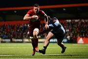 5 April 2019; CJ Stander of Munster gets away from Dillon Lewis of Cardiff Blues on his way to scoring his side's third try during the Guinness PRO14 Round 19 match between Munster and Cardiff Blues at Irish Independent Park in Cork. Photo by Diarmuid Greene/Sportsfile