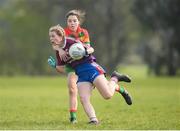 6 April 2019; Brenda Naughton of Coláiste Bhaile Chláir, Claregalway, in action against Emily Druse of St Catherine's, Armagh, during the Lidl All Ireland Post Primary School Junior A Final match between Coláiste Bhaile Chláir, Claregalway, Galway, and St Catherine’s, Armagh, at Philly McGuinness Memorial Park in Mohill in Co Leitrim. Photo by Stephen McCarthy/Sportsfile