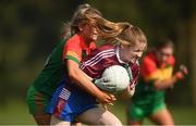 6 April 2019; Maeve McGarry of Coláiste Bhaile Chláir, Claregalway, in action against Casey Mullan of St Catherine's, Armagh, during the Lidl All Ireland Post Primary School Junior A Final match between Coláiste Bhaile Chláir, Claregalway, Galway, and St Catherine’s, Armagh, at Philly McGuinness Memorial Park in Mohill in Co Leitrim. Photo by Stephen McCarthy/Sportsfile