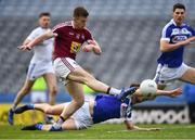 6 April 2019; Ger Egan of Westmeath shoots past Colm Begley of Laois to score the only goal of the Allianz Football League Division 3 Final match between Laois and Westmeath at Croke Park in Dublin. Photo by Ray McManus/Sportsfile