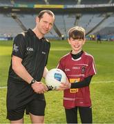 6 April 2019; Referee Jerome Henry with eleven year old Paul Keating, from Mullingar, who presented the ball  before the Allianz Football League Division 3 Final match between Laois and Westmeath at Croke Park in Dublin. Photo by Ray McManus/Sportsfile