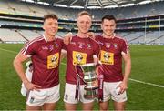 6 April 2019; Westmeath players Tommy McDaniel, left, Killian Daly and David Lynch, right, celebrate with the cup after the Allianz Football League Division 3 Final match between Laois and Westmeath at Croke Park in Dublin. Photo by Ray McManus/Sportsfile