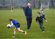 8 April 2019; Uachtarán Chumann Lúthchleas Gael John Horan watches on as juvenile members of St Colmcilles GAA Club participate in a game prior to the unveiling of the new GAA manifesto in both Irish and English at St Colmcilles GAA Club in Bettystown, Co Meath. The manifesto is an affirmation of the GAA's mission, vision and values, and a celebration of all the people who make the Association what it is. The intention is for the manifesto to be proudly displayed across the GAA network and wherever Gaelic Games are played at home and abroad&quot;. It marks the start of a wider support message that celebrates belonging to the GAA, which is centered around the statement: ‘GAA – Where We All Belong’ / CLG – Tá Áit Duinn Uilig’. Photo by Stephen McCarthy/Sportsfile