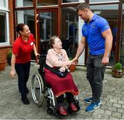 12 April 2019; MS Ireland are a charity partner of Leinster Rugby and as part of their partnership they will have a match day take-over at the RDS Arena tomorrow. Ahead of the game Leo Cullen and Seán O’Brien visited staff and patients at the MS Ireland Care Centre in Dublin. Pictured is Seán O'Brien with patient Margo Taplin. Photo by Ramsey Cardy/Sportsfile