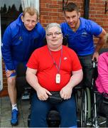 12 April 2019; MS Ireland are a charity partner of Leinster Rugby and as part of their partnership they will have a match day take-over at the RDS Arena tomorrow. Ahead of the game Leo Cullen and Seán O’Brien visited staff and patients at the MS Ireland Care Centre in Dublin. Pictured is head coach Leo Cullen and Seán O'Brien with resident Kieran Whelan. Photo by Ramsey Cardy/Sportsfile