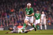 12 April 2019; Stephen Hunt of Republic of Ireland XI in action against Jermaine Pennant of Liverpool FC Legends during the Sean Cox Fundraiser match between the Republic of Ireland XI and Liverpool FC Legends at the Aviva Stadium in Dublin. Photo by Stephen McCarthy/Sportsfile