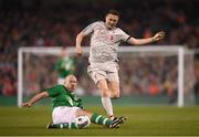 12 April 2019; Robbie Keane of of Liverpool FC Legends in action against Kenny Cunningham of Republic of Ireland XI during the Sean Cox Fundraiser match between the Republic of Ireland XI and Liverpool FC Legends at the Aviva Stadium in Dublin. Photo by Stephen McCarthy/Sportsfile