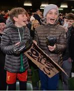 12 April 2019; Aaron Murphy, aged 11, right, and Jamie Casey, aged 11, from Dublin, celebrate after being given Robbie Fowlers boots following the Sean Cox Fundraiser match between the Republic of Ireland XI and Liverpool FC Legends at the Aviva Stadium in Dublin. Photo by Sam Barnes/Sportsfile