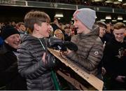12 April 2019; Aaron Murphy, aged 11, right, and Jamie Casey, aged 11, from Dublin, celebrate after being given Robbie Fowlers boots following the Sean Cox Fundraiser match between the Republic of Ireland XI and Liverpool FC Legends at the Aviva Stadium in Dublin. Photo by Sam Barnes/Sportsfile