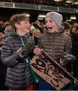 12 April 2019; Aaron Murphy, aged 11, and Jamie Casey, aged 11, from Dublin, celebrate after being given Robbie Fowlers boots following the Sean Cox Fundraiser match between the Republic of Ireland XI and Liverpool FC Legends at the Aviva Stadium in Dublin. Photo by Sam Barnes/Sportsfile