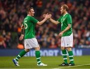 12 April 2019; Liam Lawrence is replaced by his Republic of Ireland XI team-mate Jason McAteer during the Sean Cox Fundraiser match between the Republic of Ireland XI and Liverpool FC Legends at the Aviva Stadium in Dublin. Photo by Stephen McCarthy/Sportsfile