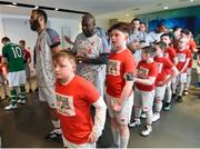 12 April 2019; Players and mascots prior to the Sean Cox Fundraiser match between the Republic of Ireland XI and Liverpool FC Legends at the Aviva Stadium in Dublin. Photo by Stephen McCarthy/Sportsfile
