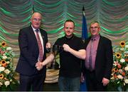 13 April 2019; Connacht team Michael Burke from Ballinderreen, Galway, is presented with the cup by Uachtarán Chumann Lúthchleas Gael John Horan and Aodán Ó Braonáin, Cathaoirleach, Choiste Náisiúnta Scór after winning the Amhránaíocht Aonair catagory during the Scór Sinsir All Ireland Finals at the TF Royal hotel and theatre, Old Westport road in Castlebar, Co Mayo. Photo by Eóin Noonan/Sportsfile