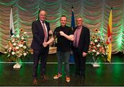 13 April 2019; Connacht team Michael Burke from Ballinderreen, Galway, is presented with the cup by Uachtarán Chumann Lúthchleas Gael John Horan and Aodán Ó Braonáin, Cathaoirleach, Choiste Náisiúnta Scór after winning the Amhránaíocht Aonair catagory during the Scór Sinsir All Ireland Finals at the TF Royal hotel and theatre, Old Westport road in Castlebar, Co Mayo. Photo by Eóin Noonan/Sportsfile