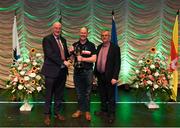 13 April 2019; Ulster team Michael McGibney from Cornafean, Cavan, is presented with the cup by Uachtarán Chumann Lúthchleas Gael John Horan and Aodán Ó Braonáin, Cathaoirleach, Choiste Náisiúnta Scór after winning the Aithriseoireacht catagory during the Scór Sinsir All Ireland Finals at the TF Royal hotel and theatre, Old Westport road in Castlebar, Co Mayo. Photo by Eóin Noonan/Sportsfile