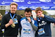 14 April 2019; Runners, from left, Erik Haaland, Nadim Ansary and Henrik Schiller celebrate with their medals following the Great Ireland Run 2019 in conjunction with AAI National 10k Championships at Phoenix Park in Dublin. Photo by Sam Barnes/Sportsfile