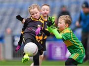 14 April 2019; Emma Condra of Nobber, Co Meath, in action against Donie Connaughton of Tubberclair, Co Westmeath, during the Littlewoods Ireland Go Games Provincial Days in Croke Park. This year over 6,000 boys and girls aged between six and twelve represented their clubs in a series of mini blitzes and just like their heroes got to play in Croke Park. Photo by Piaras Ó Mídheach/Sportsfile