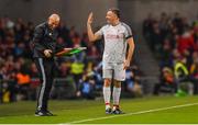 12 April 2019; John Aldridge of Liverpool FC Legends jokes with fourth official Paul Tuite during the Sean Cox Fundraiser match between the Republic of Ireland XI and Liverpool FC Legends at the Aviva Stadium in Dublin. Photo by Sam Barnes/Sportsfile